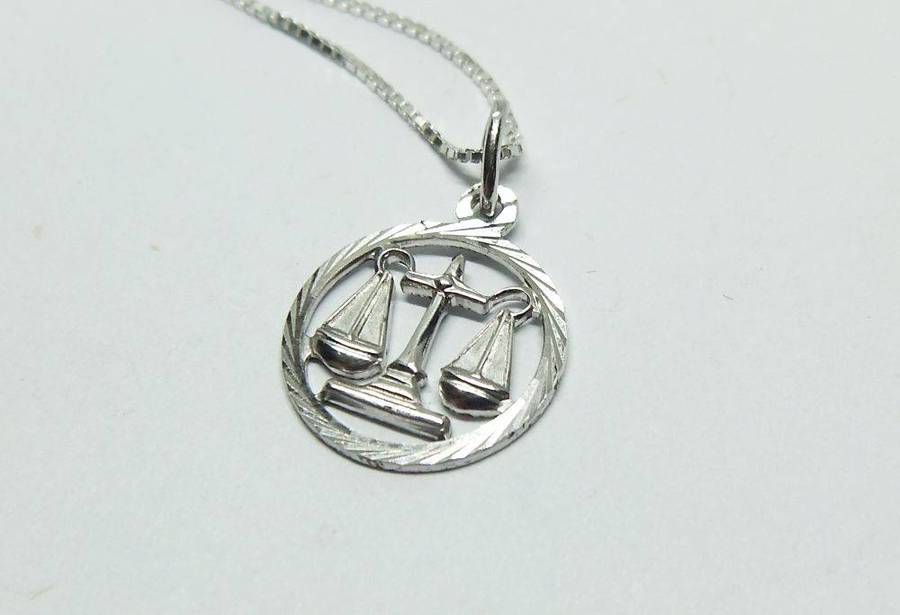 A vintage German 835 silver Libra Zodiac sign pendant with a sterling silver necklace