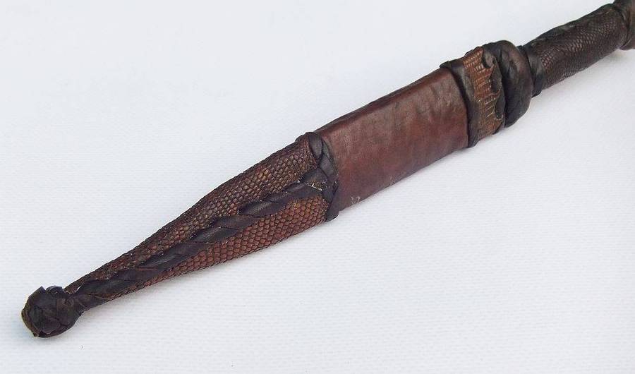 A rare antique North African Tuareg tribal dagger with leather sheath and handle