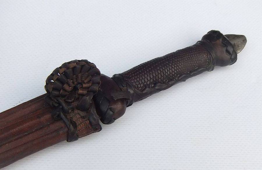 A rare antique North African Tuareg tribal dagger with leather sheath and handle