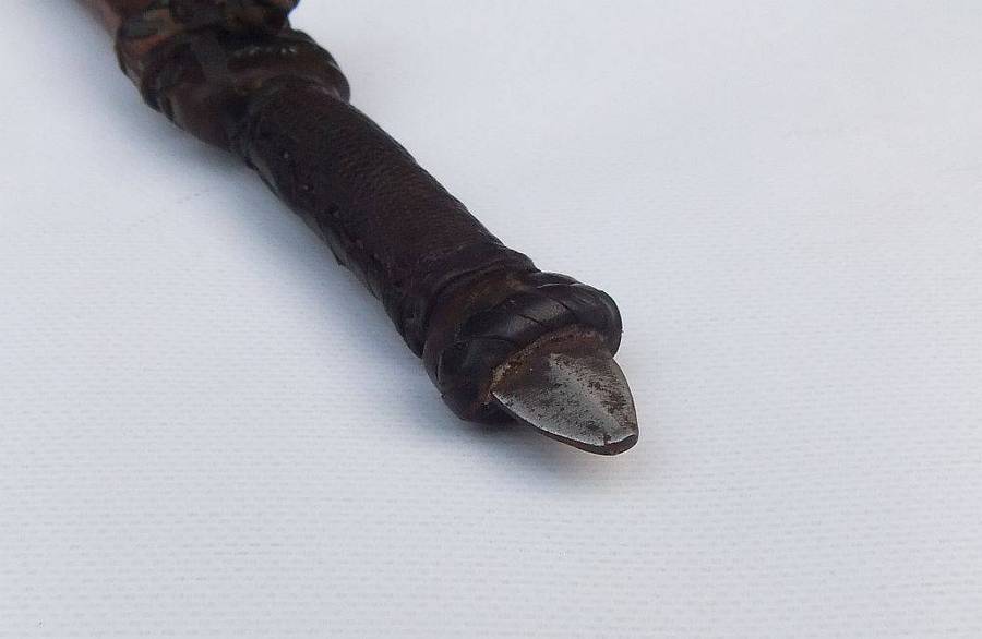 A rare antique North African Tuareg tribal dagger with leather sheath and handle