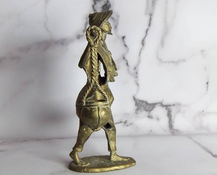 A rare mid 20th century African solid bronze statue of a water carrier