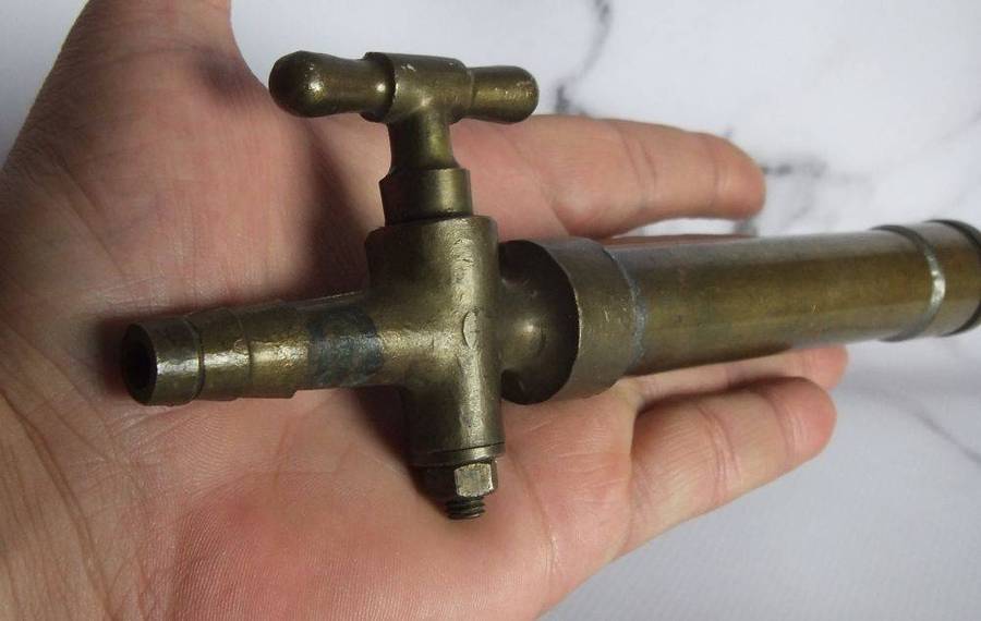 An old solid bronze or brass tap most likely alcohol related