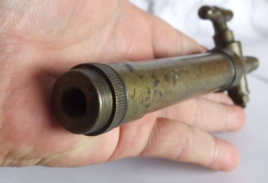 An old solid bronze or brass tap most likely alcohol related