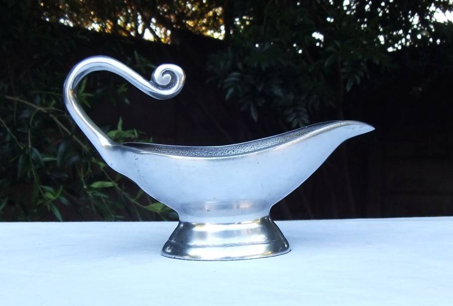 A STUNNING CARROL BOYES STYLE METAL SAUCE OR GRAVY BOAT