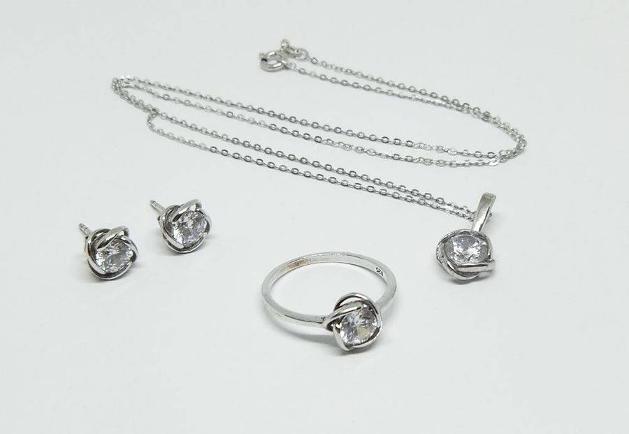 A beautiful sterling silver jewelry set including ring , earrings and necklace with pendant