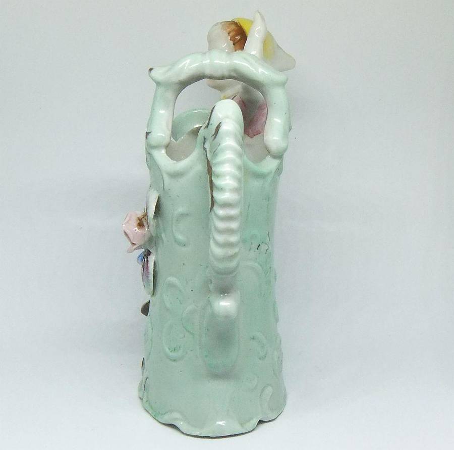 A RATHER KITSCH VINTAGE GIRL SITTING ON A WATERING CAN FIGURINE FLOWER POT IN GOOD CONDITION !!