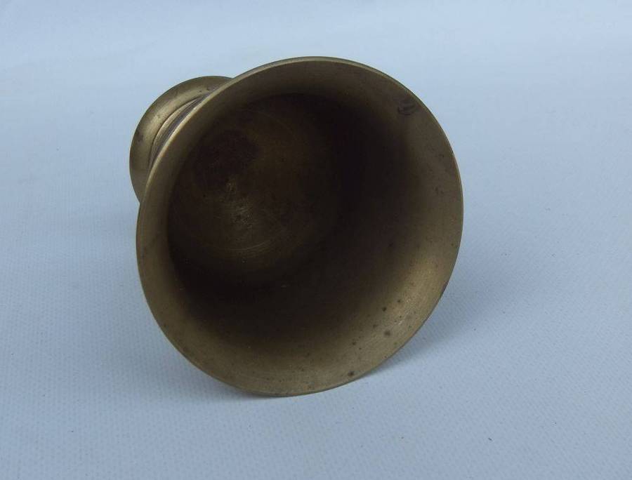 A vintage solid brass mortar and pestle in good condition