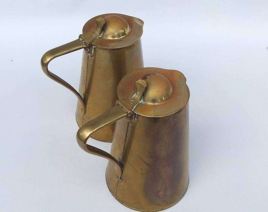 A rare pair of Art Nouveau era brass water jugs by Joseph Sankey & Sons with hinged lids