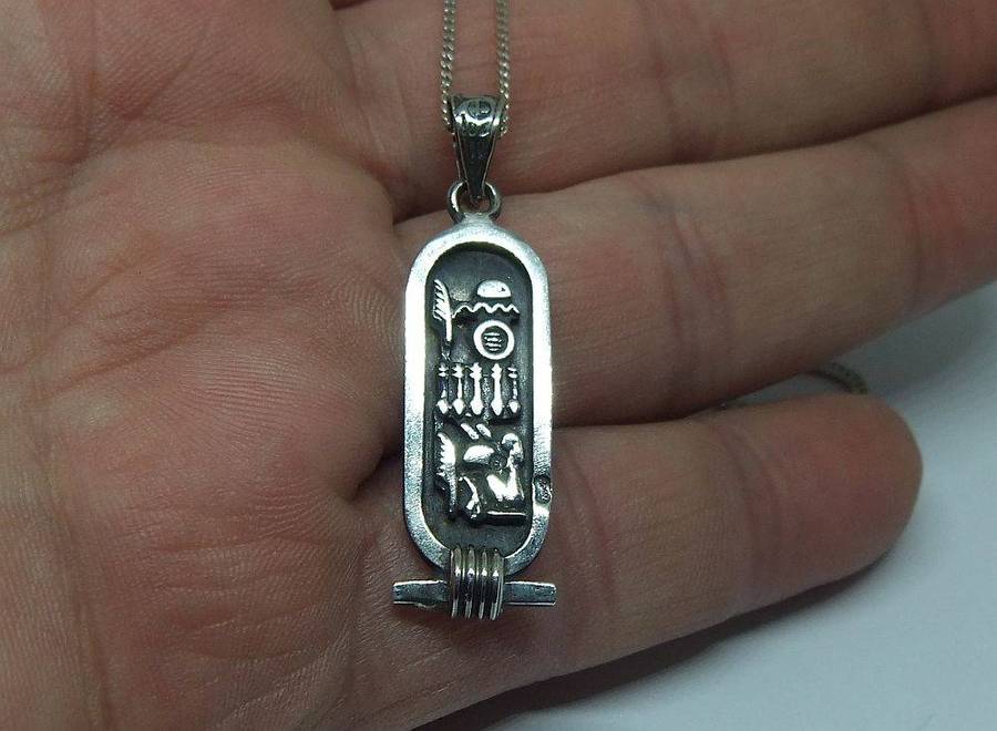 A detailed vintage Egyptian silver pendant with a sterling silver necklace