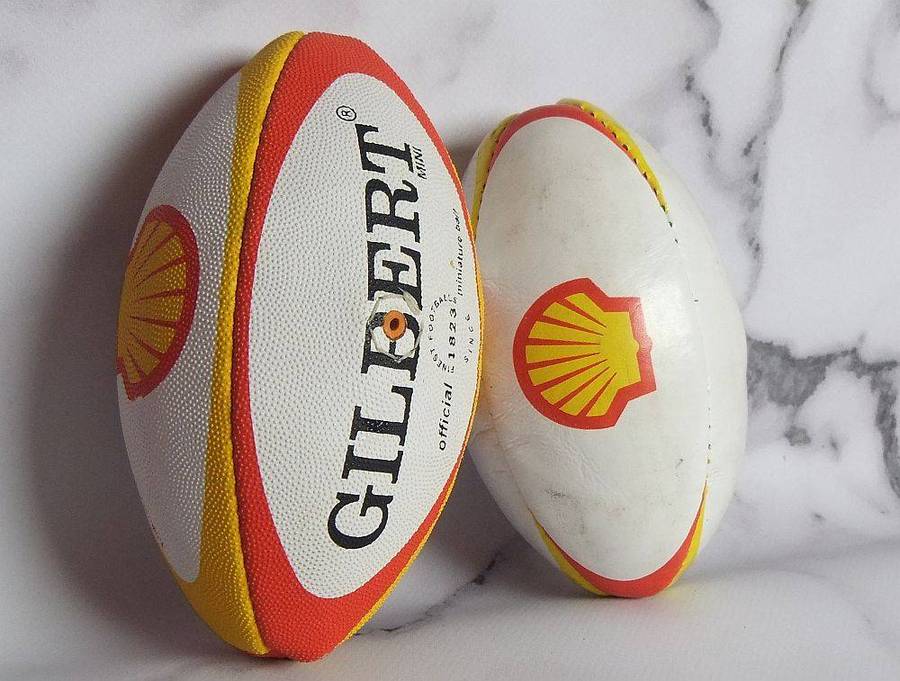 Two vintage miniature rugby balls made for the Vodacom Super 12 advertising Shell oil or fuel