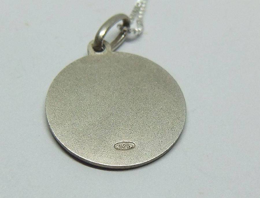 A vintage sterling silver Capricorn Zodiac sign pendant with a sterling silver necklace