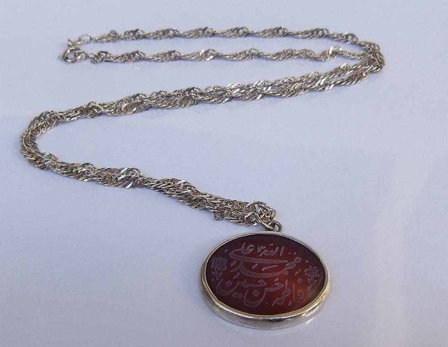A stunning twist design sterling silver necklace with engraved Carnelian stone 90% silver pendant