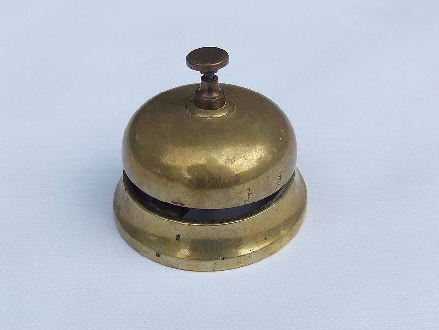 A vintage solid brass reception bell in working condition