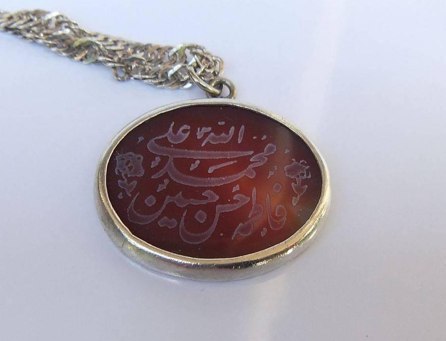 A stunning twist design sterling silver necklace with engraved Carnelian stone 90% silver pendant