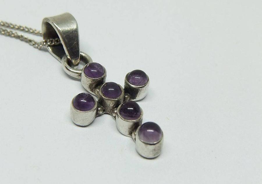 A lovely sterling silver cross pendant with cabochon Amethysts plus a sterling silver necklace