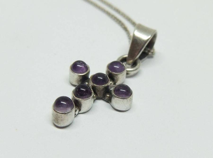 A lovely sterling silver cross pendant with cabochon Amethysts plus a sterling silver necklace