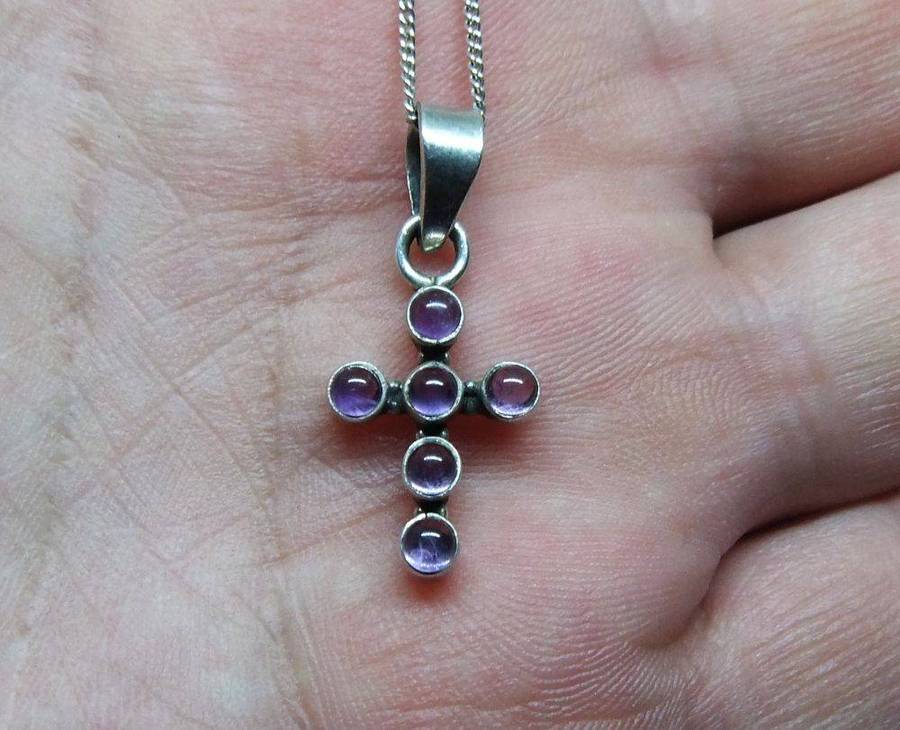 A lovely sterling silver cross pendant with cabochon Amethysts plus a sterling silver necklace