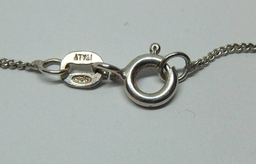 A lovely sterling silver cross pendant with cabochon Amethysts plus a sterling silver necklace