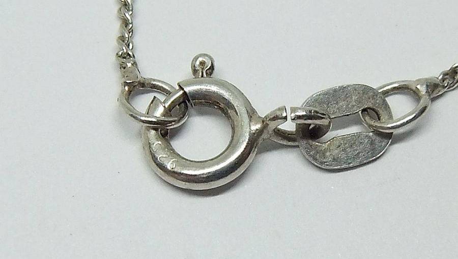 A lovely sterling silver cross pendant with cabochon Amethysts plus a sterling silver necklace