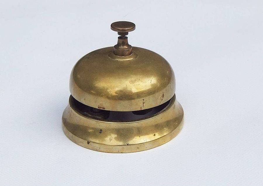 A vintage solid brass reception bell in working condition