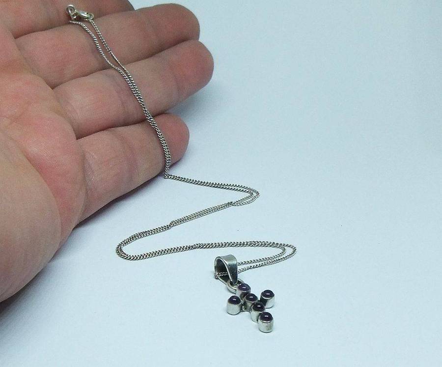 A lovely sterling silver cross pendant with cabochon Amethysts plus a sterling silver necklace