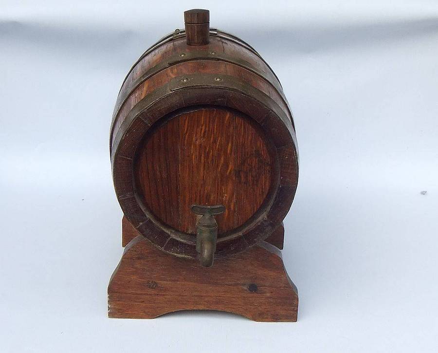 A charming vintage Oak and brass wine barrel on original stand , untested but looks great