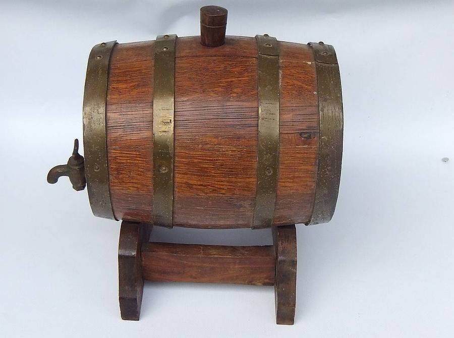 A charming vintage Oak and brass wine barrel on original stand , untested but looks great