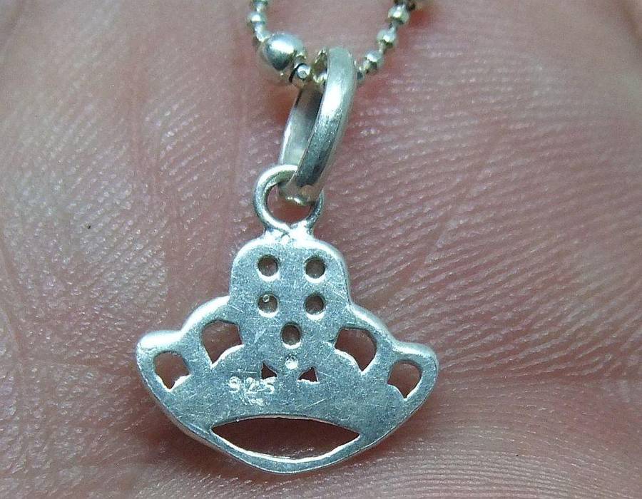 A SOLID STERLING SILVER "BALL" NECKLACE WITH A STERLING SILVER CROWN SHAPED PENDANT