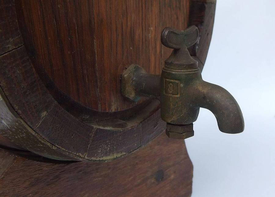 A charming vintage Oak and brass wine barrel on original stand , untested but looks great