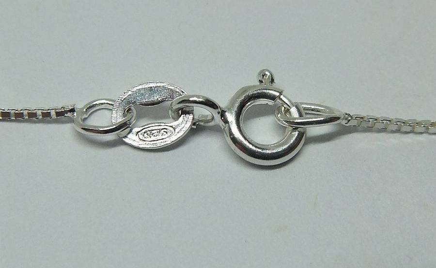 A vintage solid silver Aries Zodiac sign pendant with a sterling silver necklace