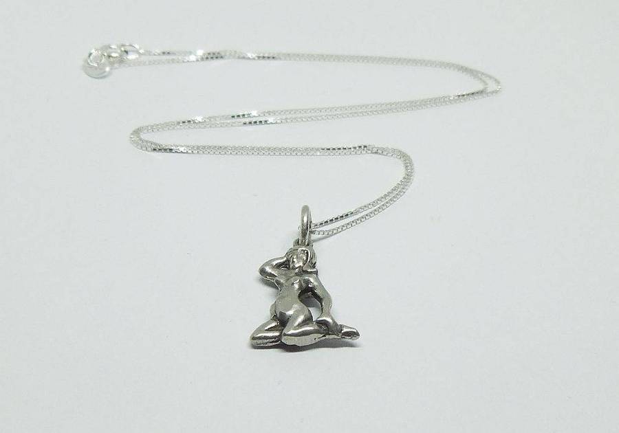 A vintage solid silver Virgo Zodiac sign pendant with a sterling silver necklace