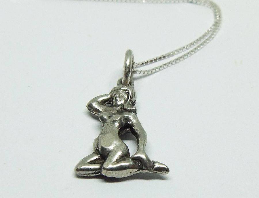 A vintage solid silver Virgo Zodiac sign pendant with a sterling silver necklace