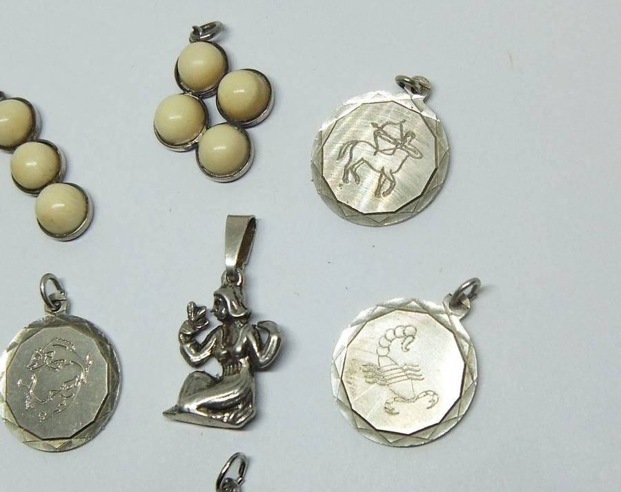 A lot of 9 vintage solid silver pendants and one sterling silver island charm