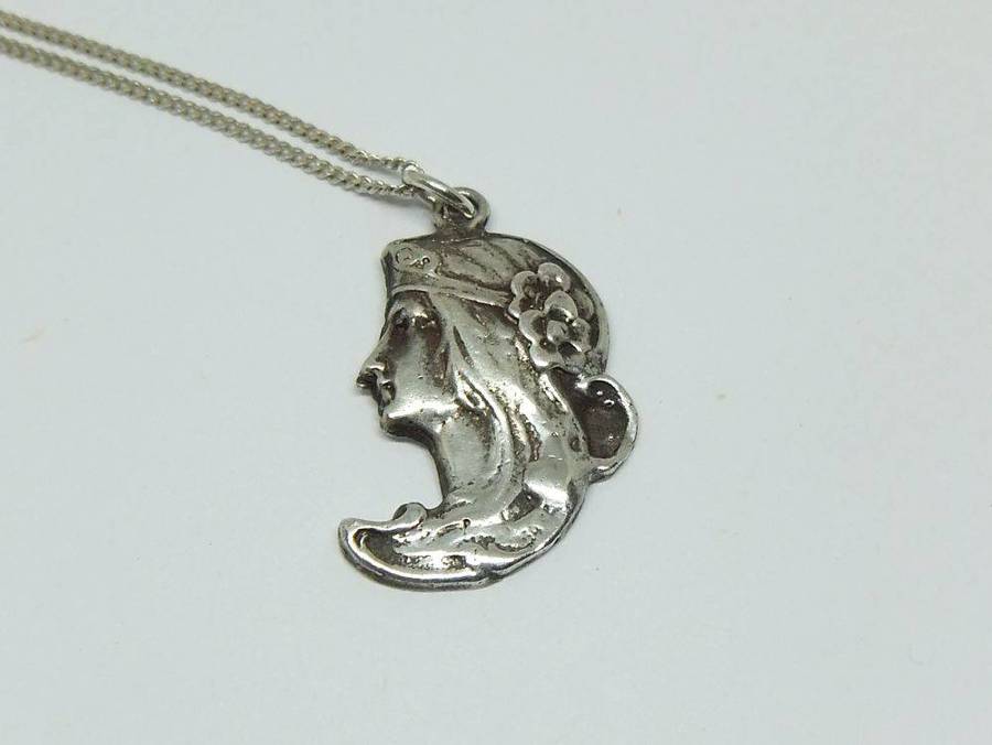 A beautiful solid sterling silver Art Nouveau style pendant with a sterling silver necklace