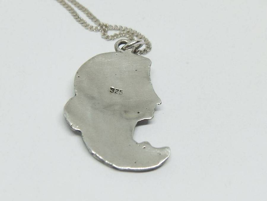 A beautiful solid sterling silver Art Nouveau style pendant with a sterling silver necklace