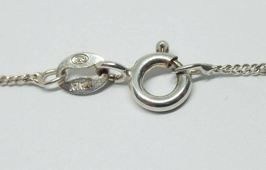 A beautiful solid sterling silver Art Nouveau style pendant with a sterling silver necklace