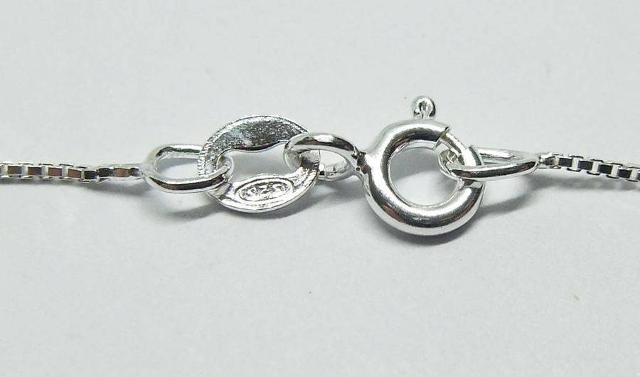 A vintage solid silver Virgo Zodiac sign pendant with a sterling silver necklace