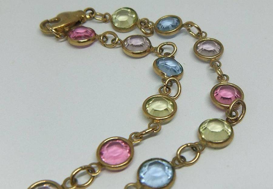 A stunning vintage gold plated necklace with faceted coloured glass insets