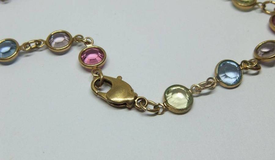 A stunning vintage gold plated necklace with faceted coloured glass insets