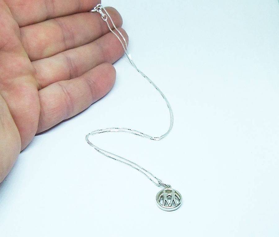 A vintage German 835 silver Gemini Zodiac sign pendant plus a sterling silver necklace