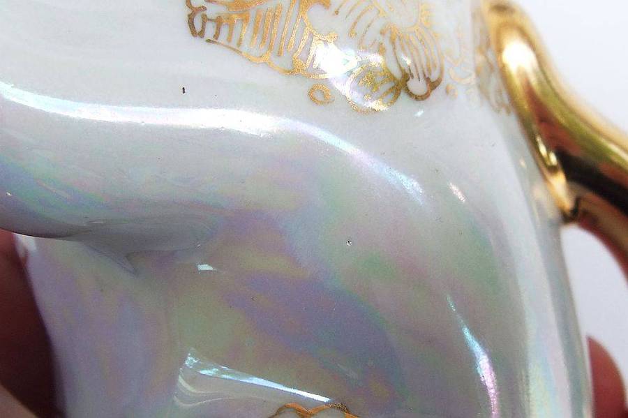 An adorable vintage hand painted porcelain kitty cat themed drink set with rainbow lustre