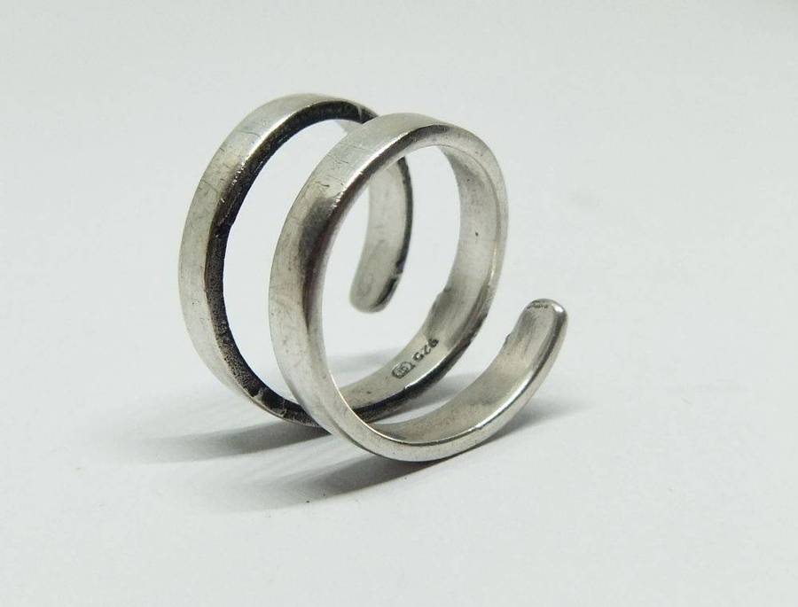 A very unusual sterling silver spiral form ring with designer stamp