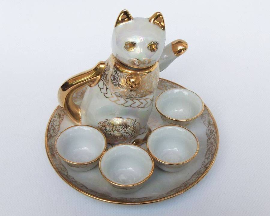 An adorable vintage hand painted porcelain kitty cat themed drink set with rainbow lustre