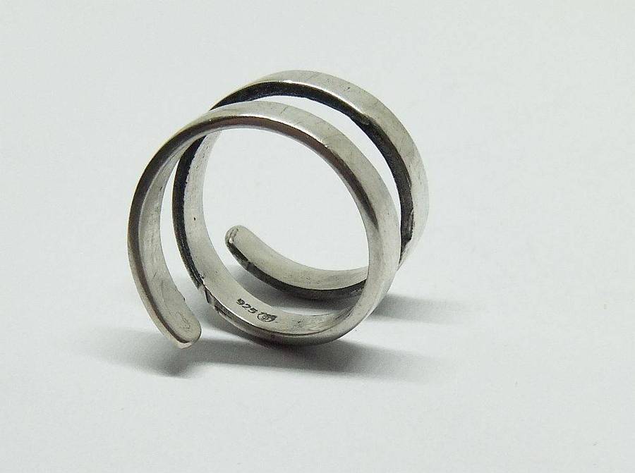 A very unusual sterling silver spiral form ring with designer stamp
