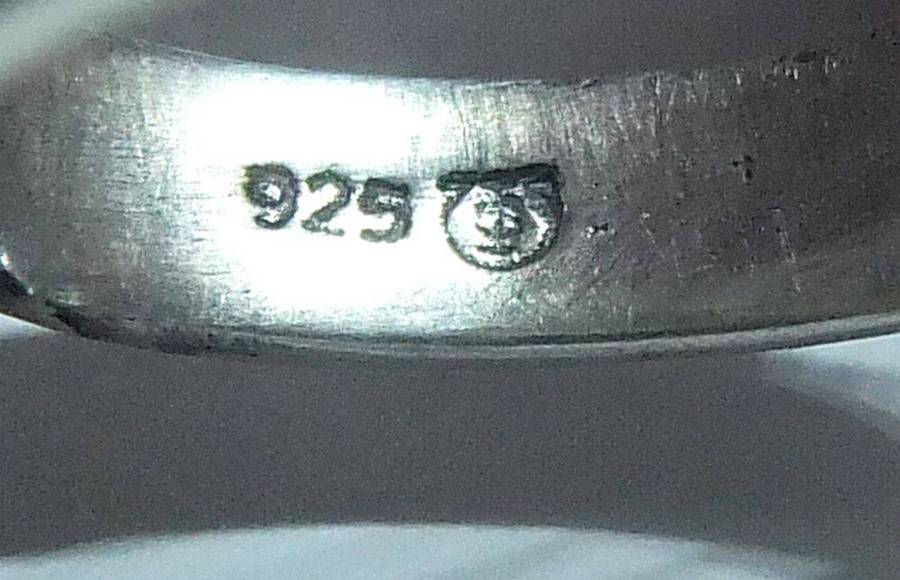 A very unusual sterling silver spiral form ring with designer stamp