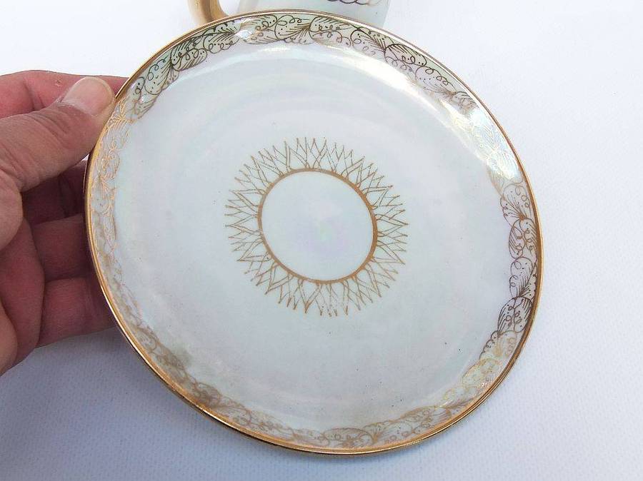 An adorable vintage hand painted porcelain kitty cat themed drink set with rainbow lustre