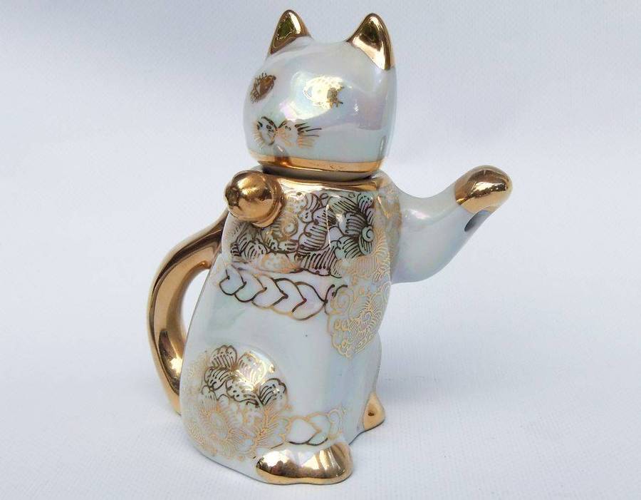 An adorable vintage hand painted porcelain kitty cat themed drink set with rainbow lustre
