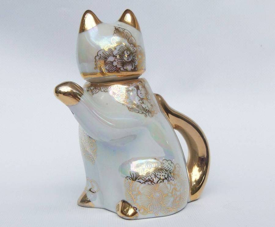 An adorable vintage hand painted porcelain kitty cat themed drink set with rainbow lustre