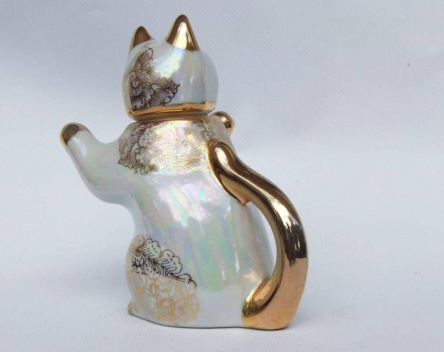 An adorable vintage hand painted porcelain kitty cat themed drink set with rainbow lustre