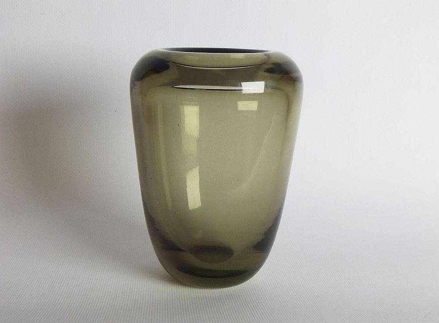 A heavy vintage Holmegaard style glass vase with polished base